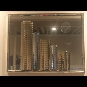 Gold framed mirrored art piece.